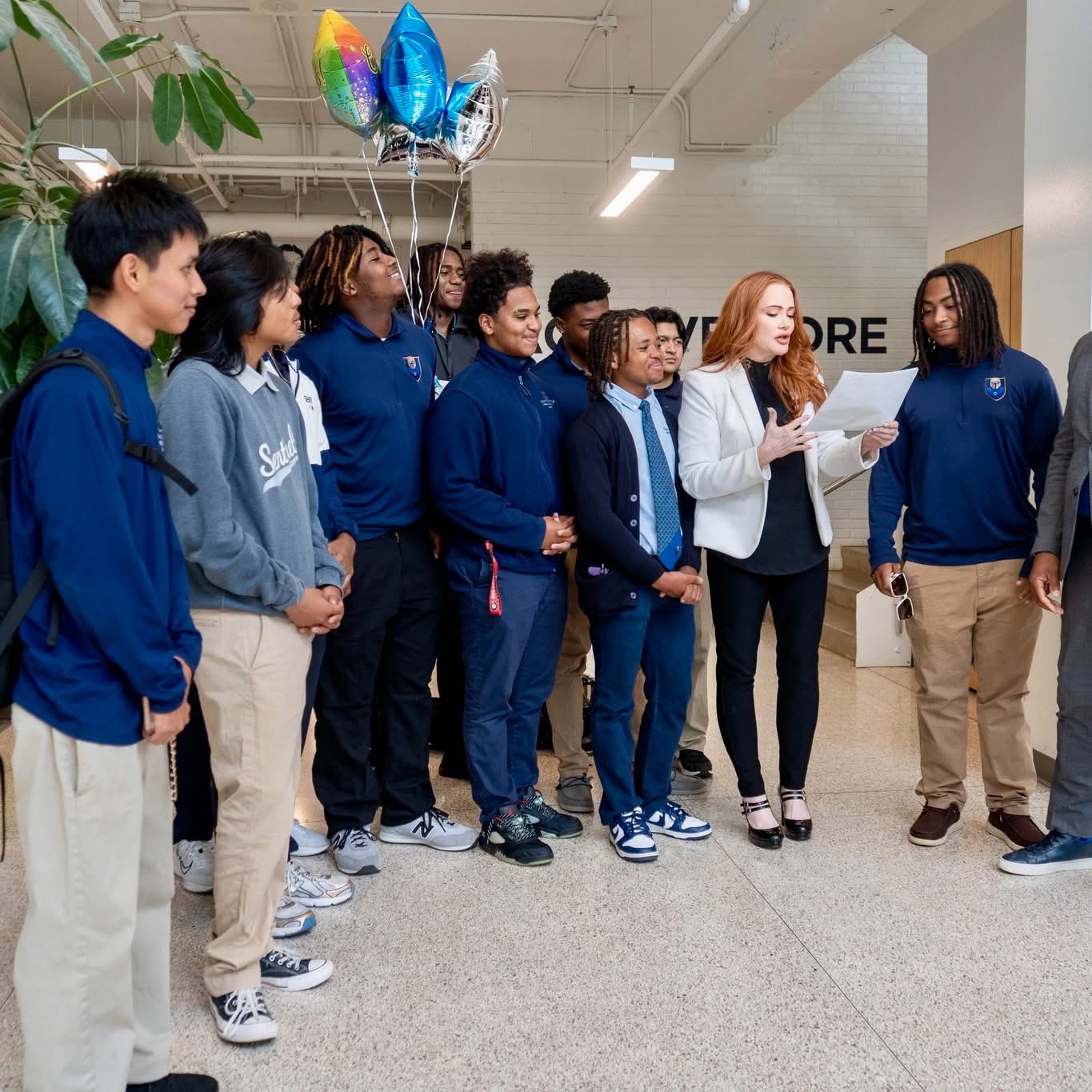 Donna Christian-Lowe with Chattanooga Preparatory School students holding Hometown Highlights certificates