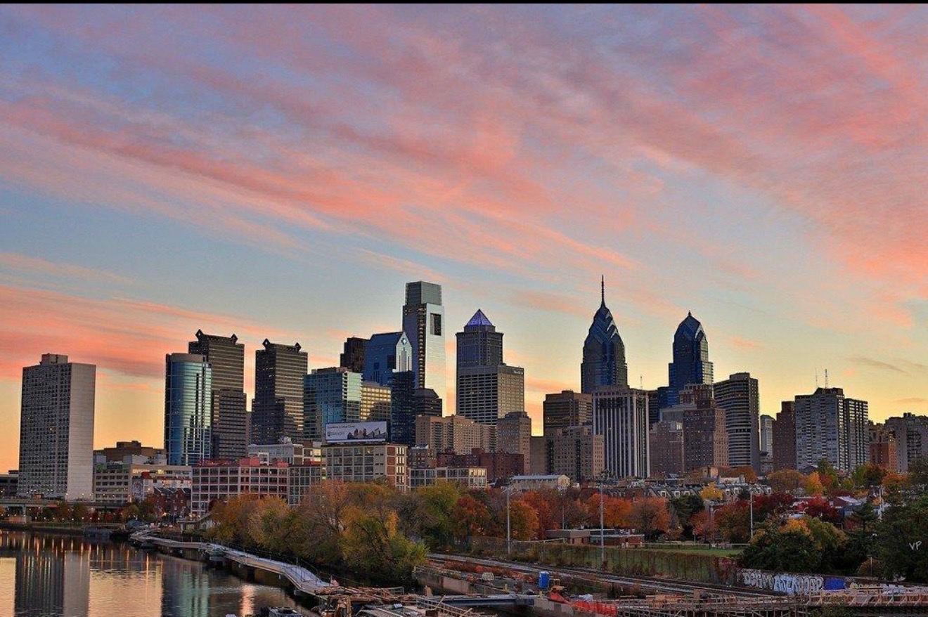 The Philadelphia skyline beneath pink and gold sunset clouds