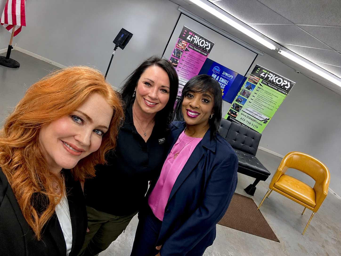 Three HR Power Panel participants taking a selfie at the event