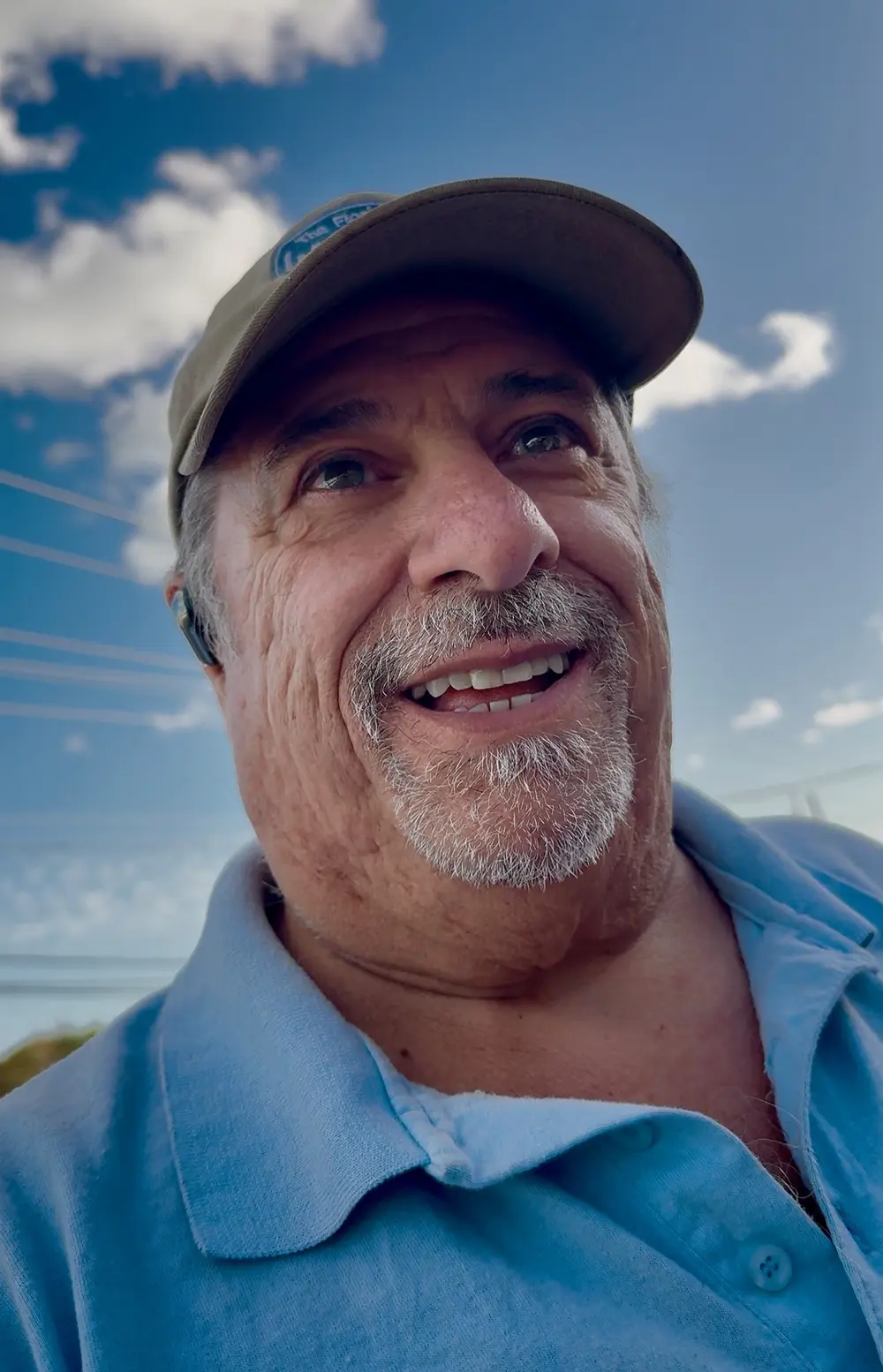 Mike wearing a blue collared polo shirt